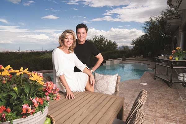 Debbie Osmond and her husband Donny Osmond poses for a picture.